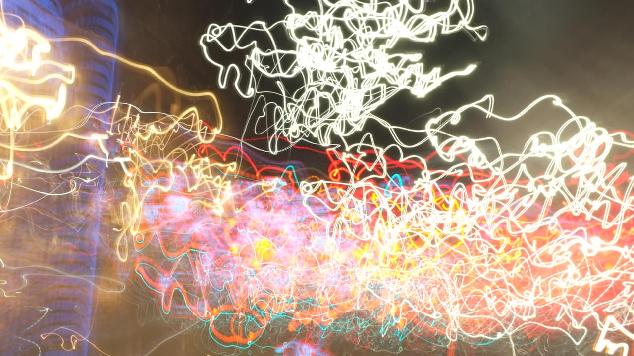 A long-exposure photo of lights that create streaks of color